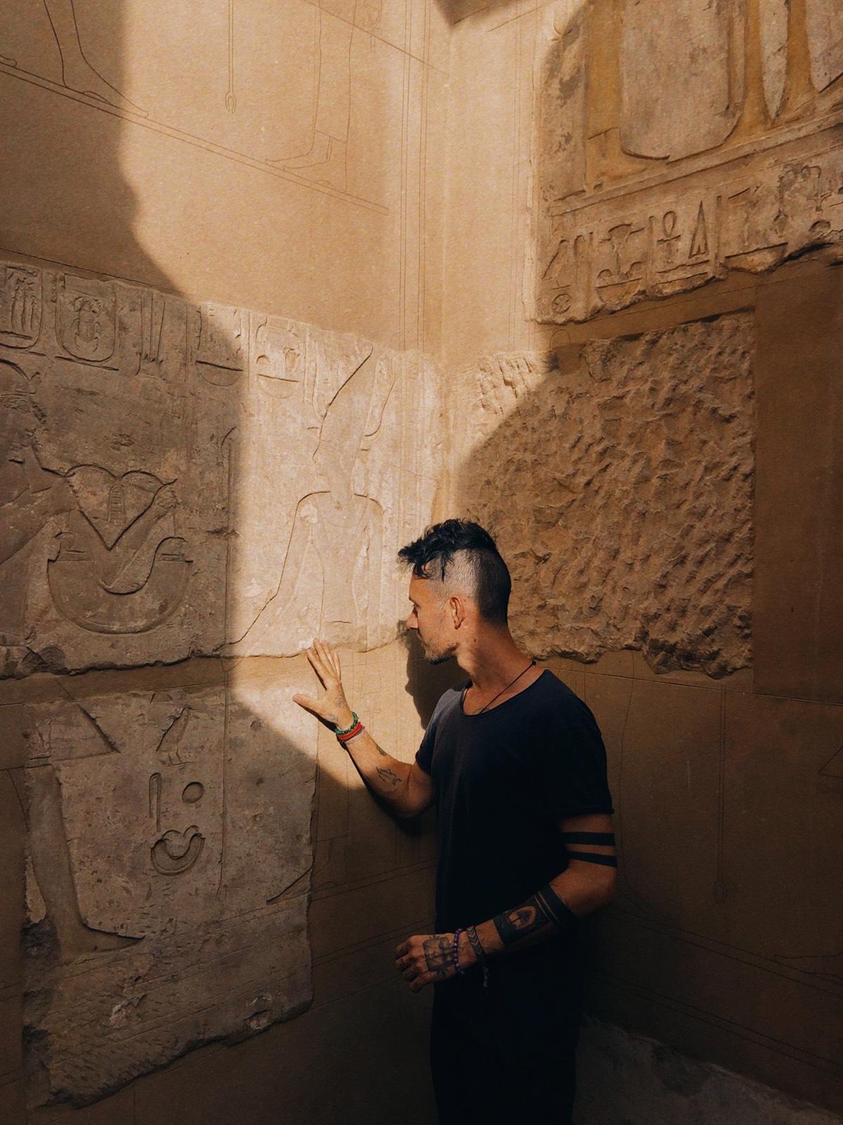 Andrei tracing hieroglyphs in an Egyptian temple
